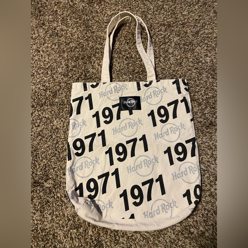5/$10 | HARDROCK CAFE TOTE | Colors: Cream, Black, & Silver | Condition: Used